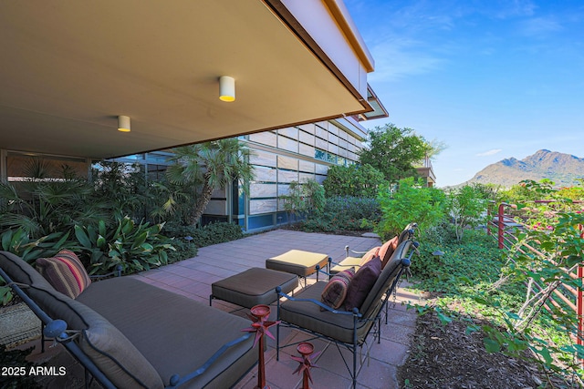 view of patio / terrace with a mountain view