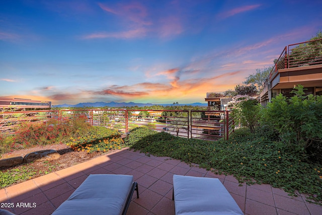 patio terrace at dusk with a mountain view