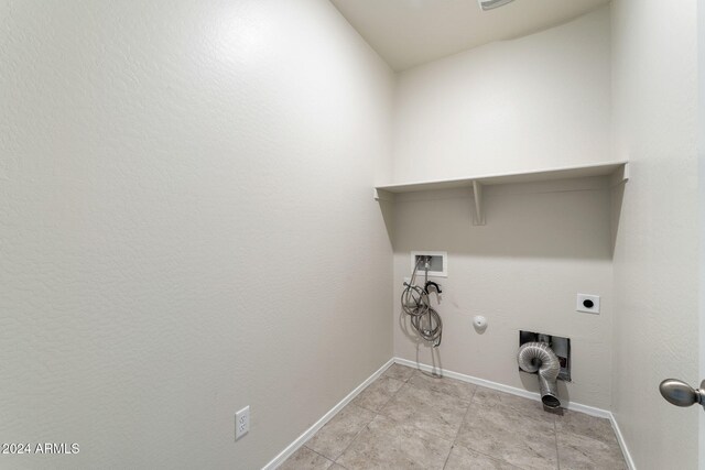 washroom with gas dryer hookup, light tile patterned flooring, hookup for a washing machine, and electric dryer hookup