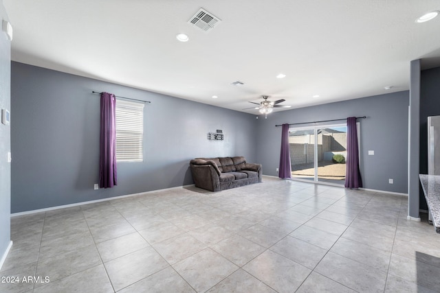 unfurnished room featuring light tile patterned flooring and ceiling fan