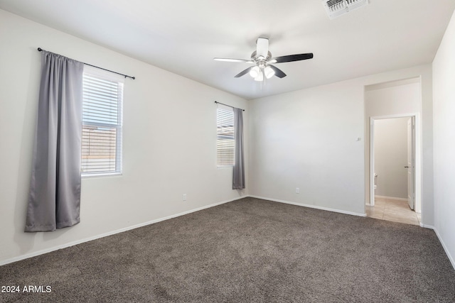 carpeted empty room with ceiling fan