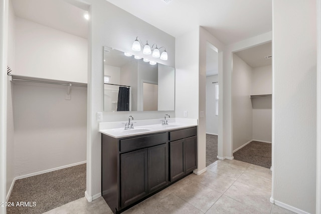 bathroom with tile patterned floors and vanity