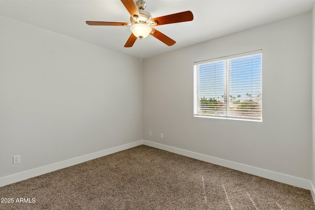 unfurnished room featuring carpet flooring, baseboards, and a ceiling fan