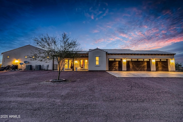 21736 W Desert Mirage Dr, Wittmann, AZ 85361 - view of front of home featuring concrete driveway, a garage, and stucco siding