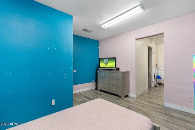 bedroom with light wood-type flooring