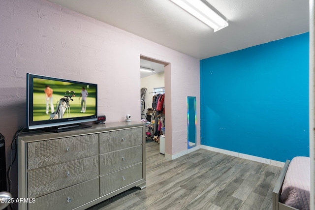 bedroom with a closet and light wood-type flooring