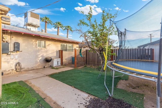 view of yard with a trampoline