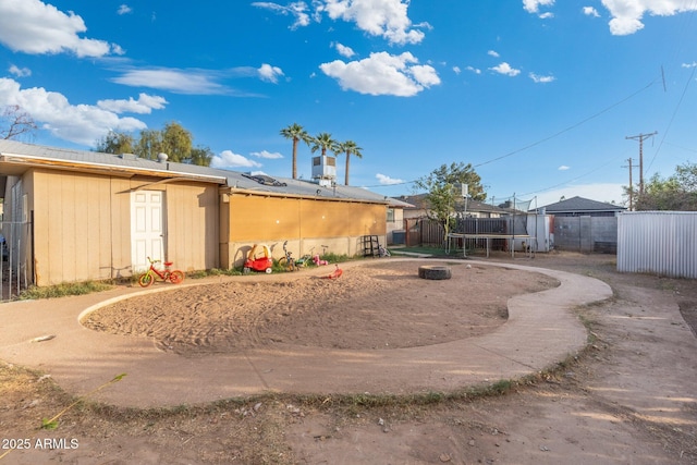 view of yard with a trampoline