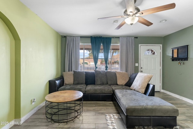 living room with hardwood / wood-style floors and ceiling fan