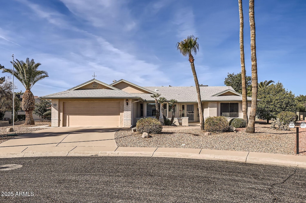 ranch-style home featuring a garage