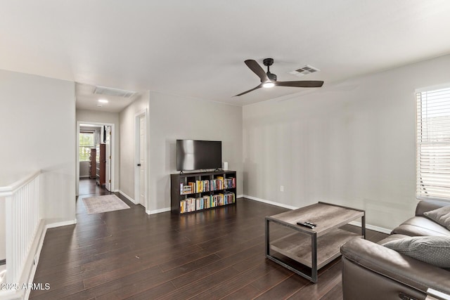 13420 W Berridge Ln, Litchfield Park, AZ 85340 - living room featuring dark wood finished floors, a ceiling fan, and baseboards