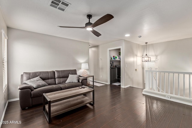 13420 W Berridge Ln, Litchfield Park, AZ 85340 - living room featuring baseboards, a ceiling fan, and dark wood-style floors