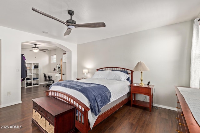 13420 W Berridge Ln, Litchfield Park, AZ 85340 - bedroom with wood finished floors, baseboards, arched walkways, and ceiling fan