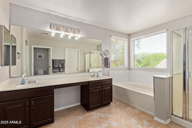 13420 W Berridge Ln, Litchfield Park, AZ 85340 - bathroom with a shower stall, double vanity, a bath, and tile patterned floors