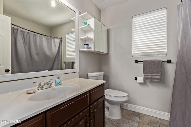 13420 W Berridge Ln, Litchfield Park, AZ 85340 - bathroom featuring toilet, baseboards, vanity, and stone finish floors