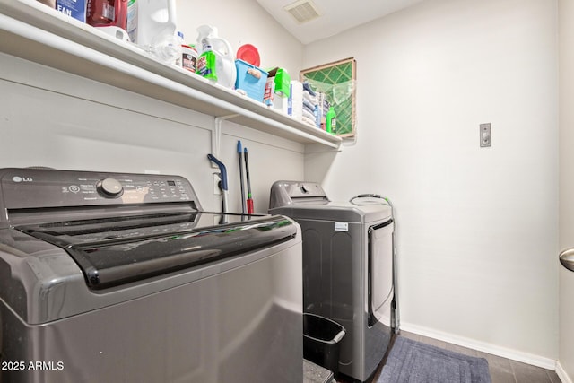13420 W Berridge Ln, Litchfield Park, AZ 85340 - washroom with washer and dryer and baseboards