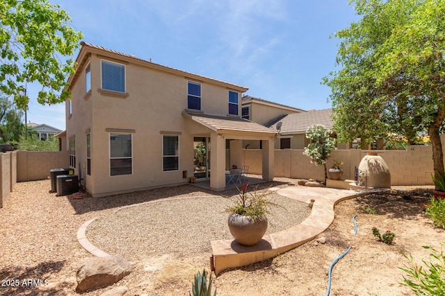 13420 W Berridge Ln, Litchfield Park, AZ 85340 - back of house with a fenced backyard, central AC, stucco siding, a patio, and a tile roof