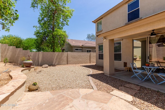 13420 W Berridge Ln, Litchfield Park, AZ 85340 - fenced backyard with a patio and a ceiling fan