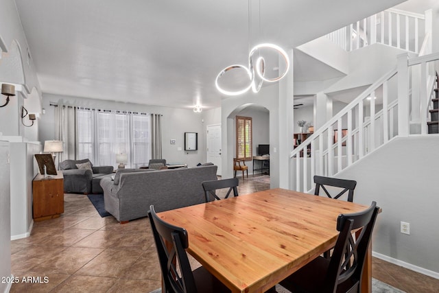 13420 W Berridge Ln, Litchfield Park, AZ 85340 - dining area with arched walkways and stairway