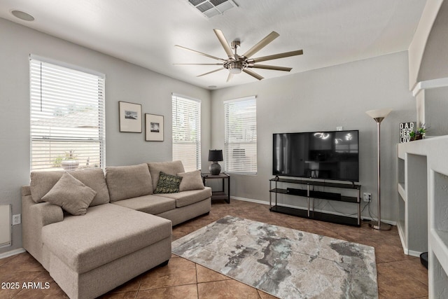 13420 W Berridge Ln, Litchfield Park, AZ 85340 - tiled living room featuring ceiling fan and baseboards