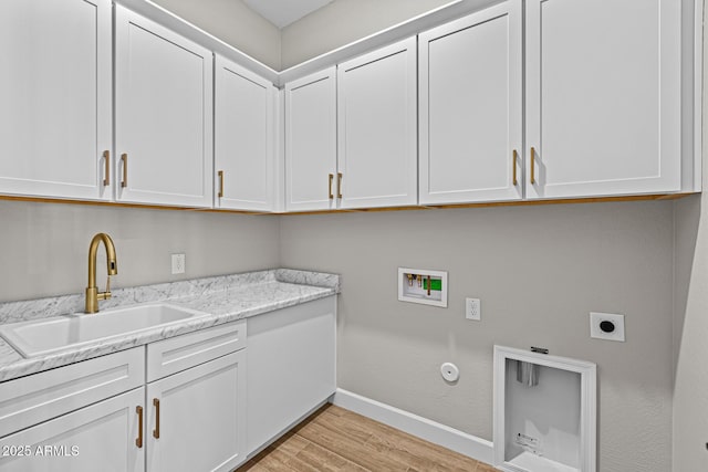 clothes washing area featuring washer hookup, cabinet space, light wood-style floors, hookup for an electric dryer, and a sink