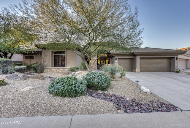 view of front of property with a garage