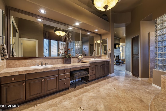 bathroom with vanity and a high ceiling