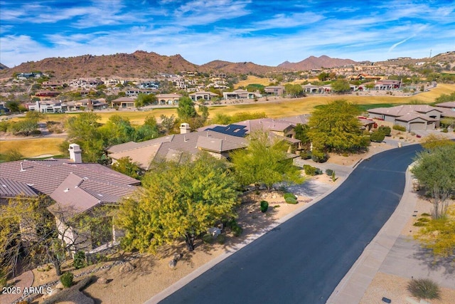 birds eye view of property featuring a mountain view