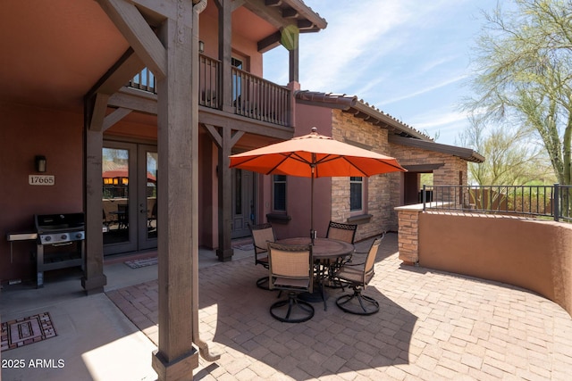 17665 N 93rd Way, Scottsdale, AZ 85255 - view of patio with french doors, a balcony, outdoor dining area, and area for grilling
