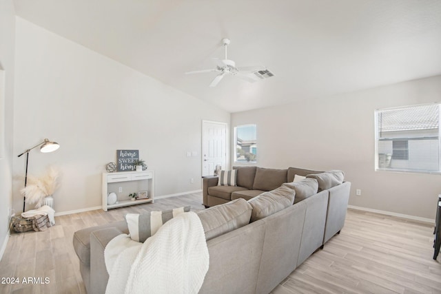 living room featuring light wood-type flooring, vaulted ceiling, and ceiling fan