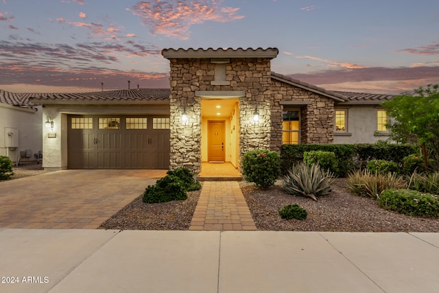 mediterranean / spanish-style house featuring a garage