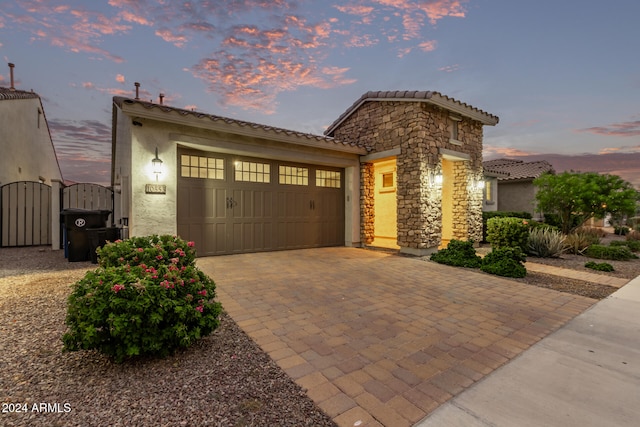 mediterranean / spanish house with a garage