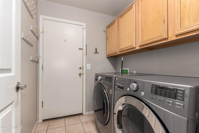 clothes washing area featuring cabinet space, independent washer and dryer, baseboards, and light tile patterned floors