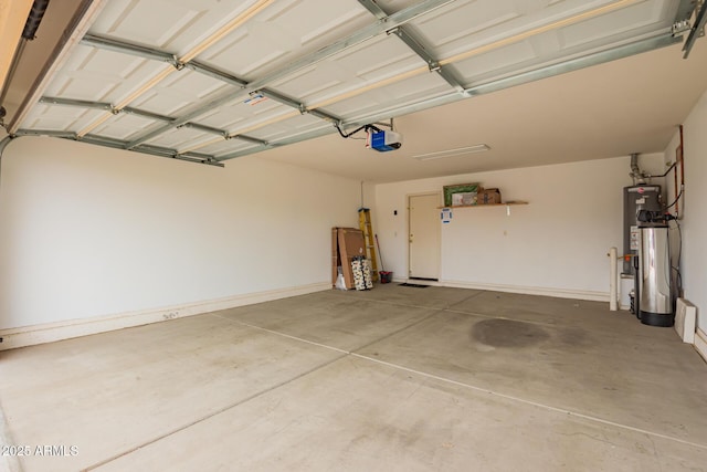 garage with a garage door opener, gas water heater, and baseboards