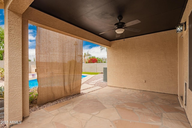 view of patio with a ceiling fan, a fenced in pool, and a fenced backyard