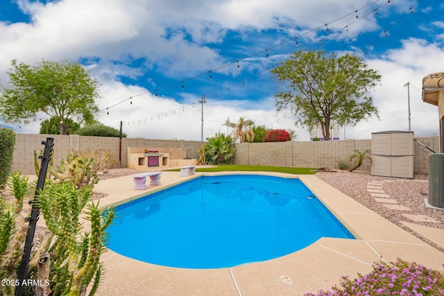 view of swimming pool with a fenced in pool, a fenced backyard, and a patio