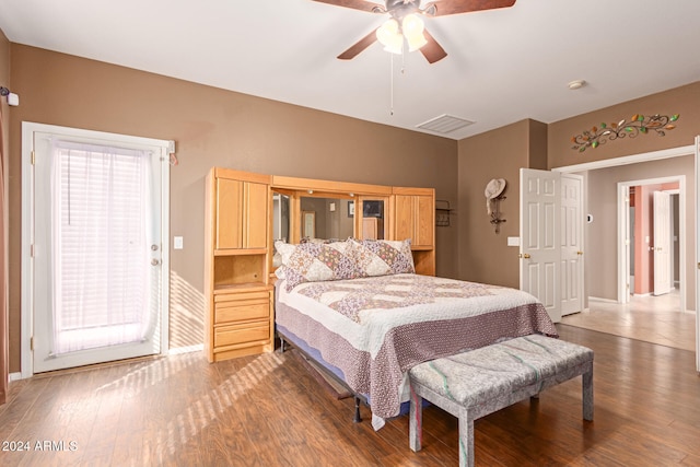 bedroom with hardwood / wood-style flooring and ceiling fan