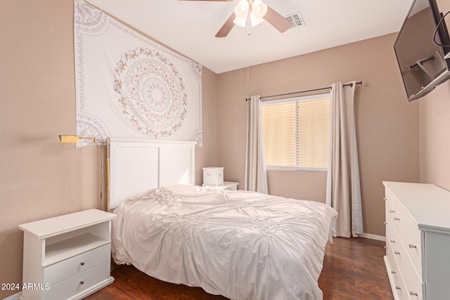 bedroom featuring ceiling fan and dark wood-type flooring