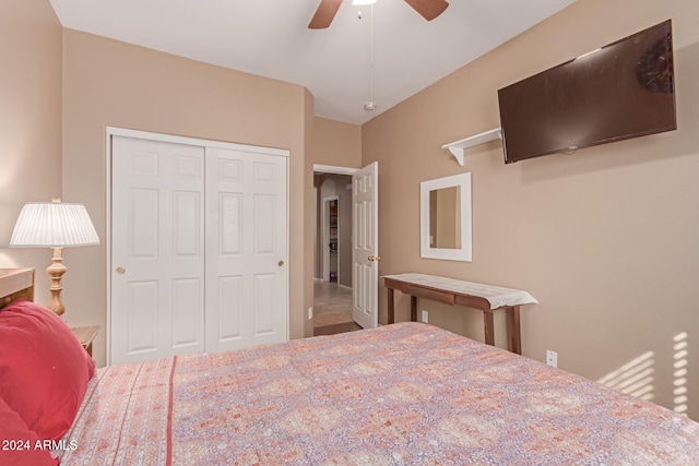 bedroom with ceiling fan and a closet