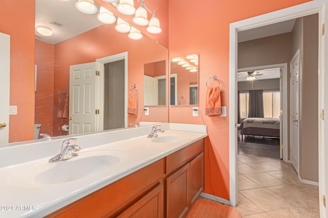 bathroom with ceiling fan, tile patterned flooring, vanity, and toilet