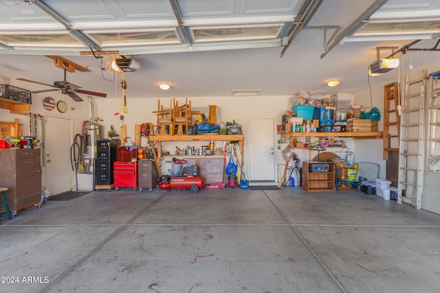 garage featuring a workshop area, ceiling fan, and a garage door opener