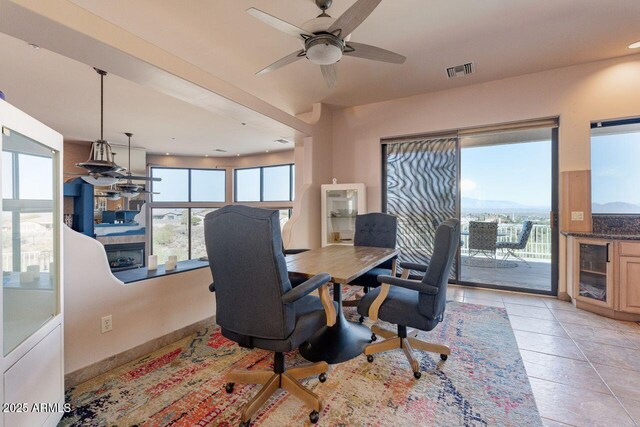 home office featuring light tile patterned floors, wine cooler, visible vents, and a ceiling fan