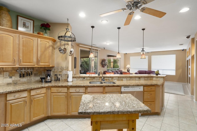 kitchen with light tile patterned flooring, a kitchen island, sink, decorative backsplash, and stainless steel dishwasher