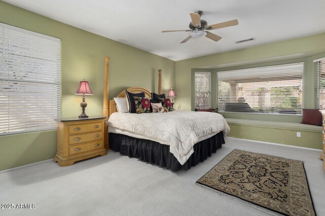 bedroom featuring vaulted ceiling, ceiling fan, and carpet