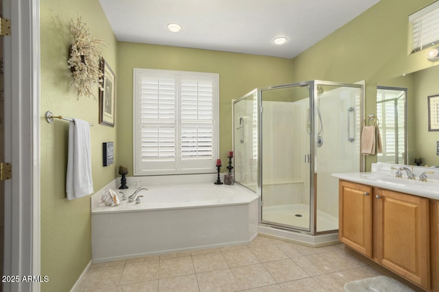 bathroom featuring tile patterned floors, separate shower and tub, and vanity