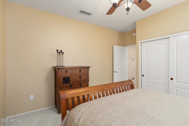 bedroom featuring light carpet, a closet, and ceiling fan