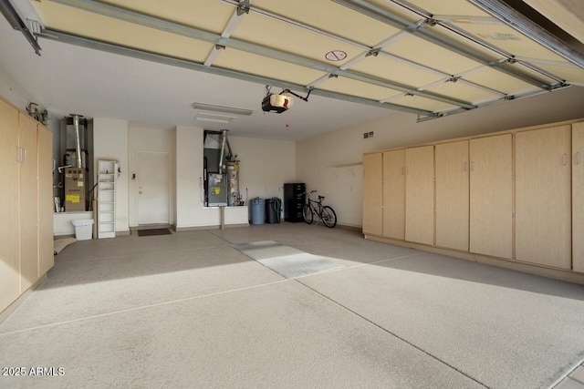 garage featuring a garage door opener and heating unit