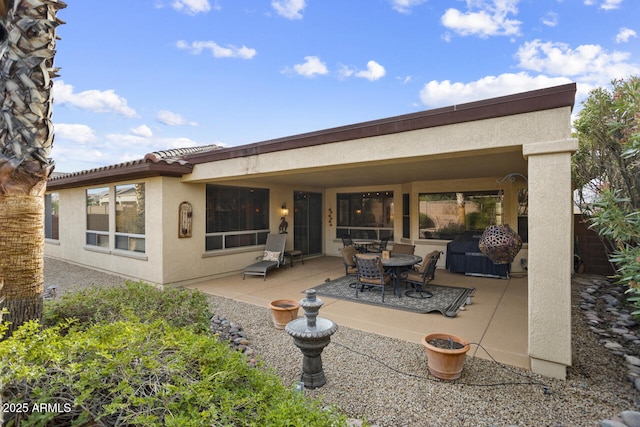 rear view of property with a patio