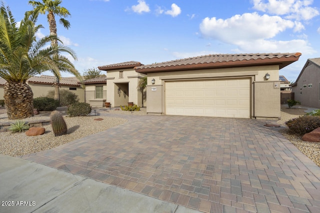 mediterranean / spanish house with a garage