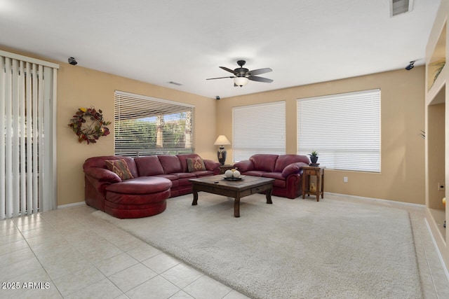 living room with light tile patterned flooring and ceiling fan